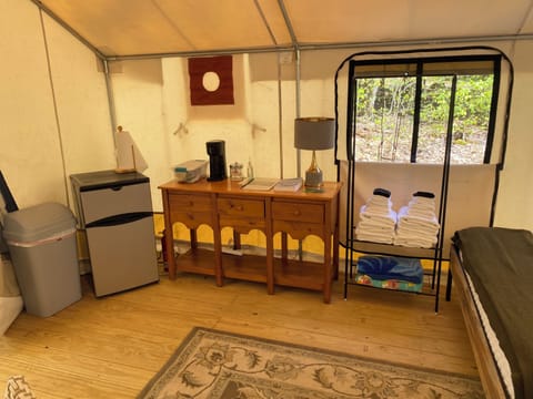 A refrigerator, garbage can, coffee maker, lamp, linens and storage to make your stay more comfortable. 