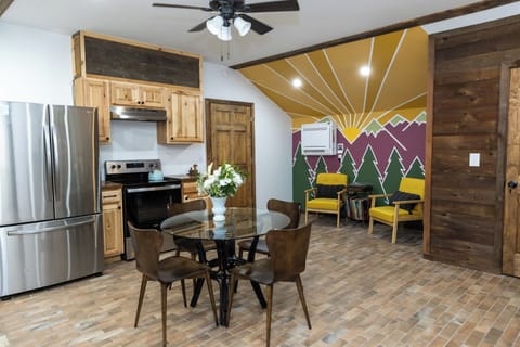 The kitchen comes equipped with a full fridge, stove, microwave, dishwasher, toaster oven and the basics for cooking a delicious meal.