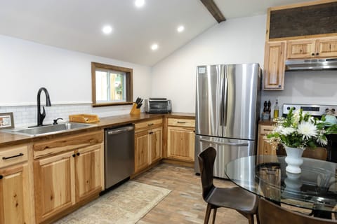 Knives, cutting boards, mixer, pots and pans. All the goodies for cooking.