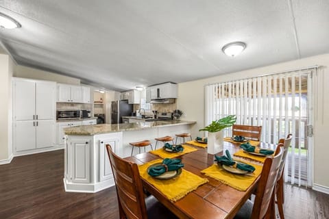 Dining area seats 6, plus 3 barstools at the kitchen island