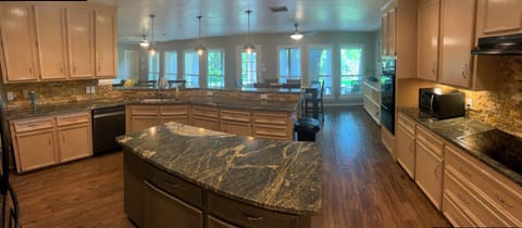 Spacious Kitchen with Island, ample counterspace and Breakfast Bar seating.
