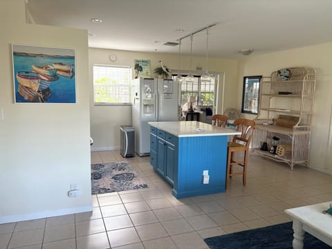 Open-concept living room seamlessly flows into the kitchen.