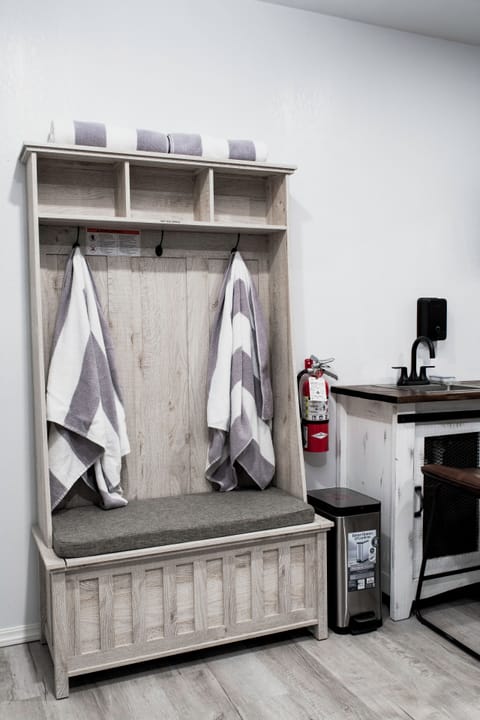 downstairs living room hall tree with hot tub towels.