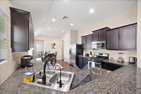 Fridge dispenses water and ice! Stainless steel appliances.