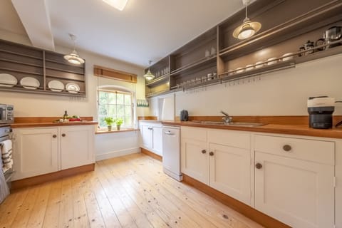First floor: A country-style fitted kitchen view river views
