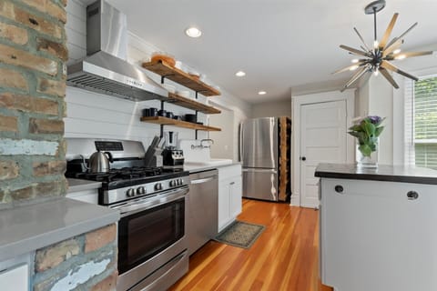 Kitchen w/ gas stove, funky light fixture