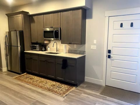 Kitchenette w/ microwave, fridge, freezer, toaster oven, sink and coffee maker