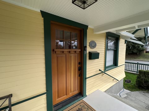 A plaque notes original1923 construction and the historic character of the home.