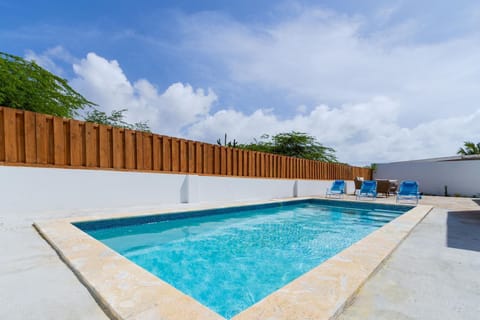 Dive into relaxation in this stunning pool area.