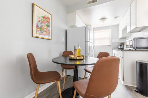 Sit down and enjoy a meal at our dining table conveniently located in the kitchen area