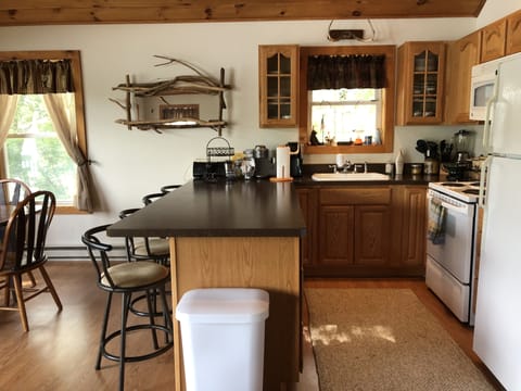 Ample counter space and storage. Four additional counter top seats for dining.