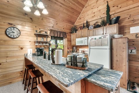 This kitchen is fully stocked from Paula Dean pots, crockpot, waffle iron etc