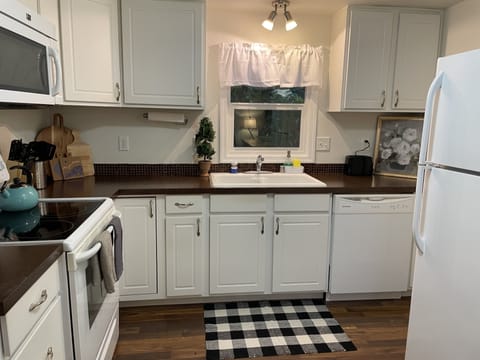 Stocked kitchen with cooking essentials and tools. 