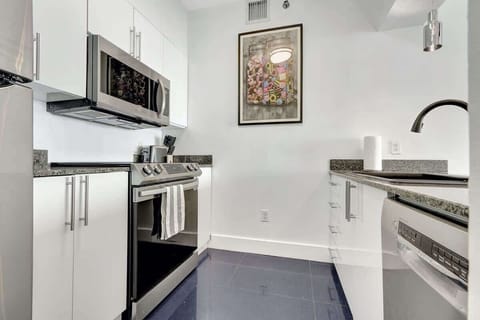 Fully stocked kitchen with complete set of cookware.