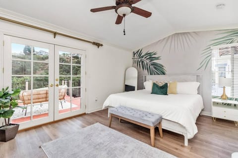 King-sized bed with outdoor deck access