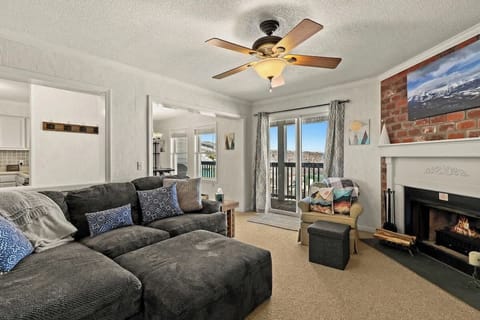 Discover comfort in our living room: plush sofa, TV, electric fireplace. Enjoy the outdoor deck or use the self-blow-up air mattress for added sleeping space. Your comfort is our priority! 
