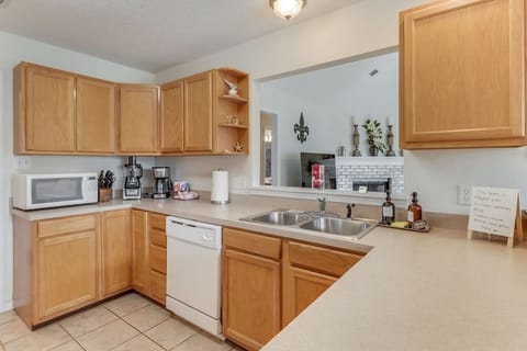 Stay at the best Airbnb in  Ocean Springs! The full kitchen provides plenty of space to cook for your group, and we also offer a drip coffee pot for your convenience, ensuring you can enjoy a perfect cup of coffee during your stay.