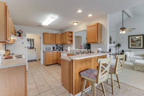 Stay at the best Airbnb in  Ocean Springs! The kitchen bar area offers seating for two guests, providing a cozy spot to enjoy a meal together.