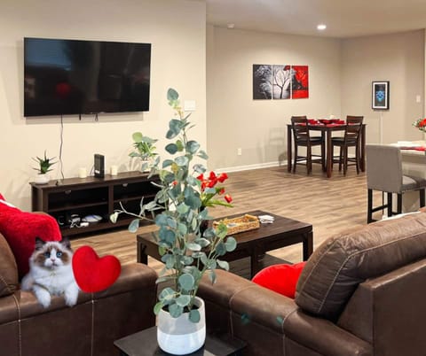 Relax at the best Airbnb in Lake Charles! Enjoy a spacious living area with comfortable Ashley fabric furniture and a 65" 4K TCL ROKU Smart TV for your favorite shows.