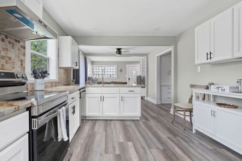 Fully equipped kitchen with modern appliances, ample counter space, and everything you need to cook at home.