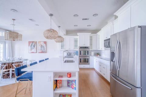 Thoughtfully stocked and beautifully lit, this open kitchen is made for cooking, connection, and casual luxury from morning to midnight.