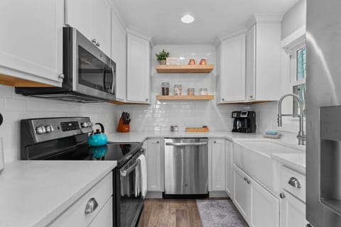 The kitchen is fully stocked with hand towels, wash cloths, pots & pans, cooking utensils, dishware, silverware, cooking oil and basic spices.