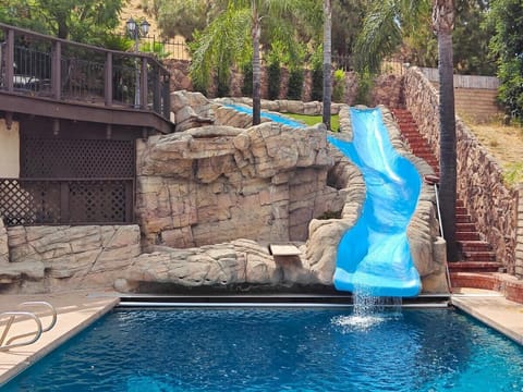 Theme park–style water slide—truly one of a kind and unlike anything you'll find in a short-term rental.