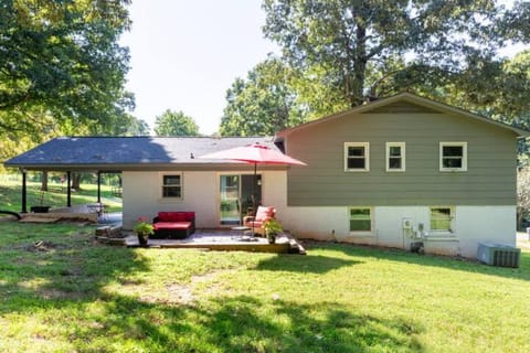 Spacious Backyard Oasis with Stylish Outdoor Furniture and State-of-the-Art Hot Tub
