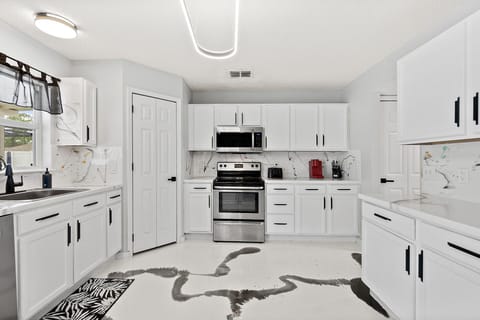 Enjoy cooking in a well-lit, updated kitchen that's equipped with stainless steel appliances