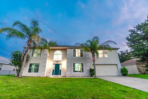 Step into the perfect Sunshine State getaway - a private, spacious home surrounded by palm trees