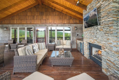 Comfortable seating with fireplace and TV.