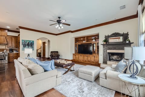 The living room also features a cozy fireplace.