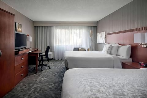 Settle into two crisp beds with an easy work desk.