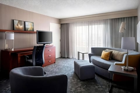 Stretch out in the spacious room with cozy seating and daylight.