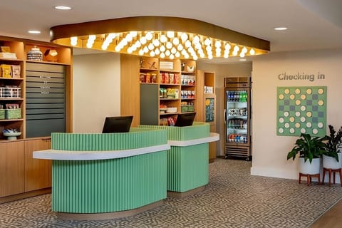 Check in smoothly beneath warm lighting and stylish design.