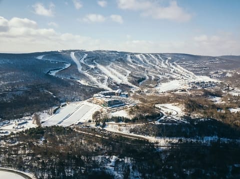 Imagine first tracks on sweeping slopes under bright skies.