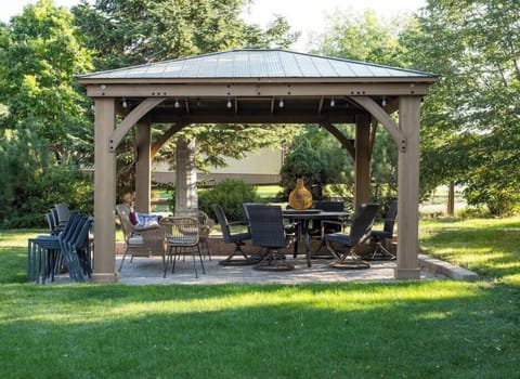 Ample backyard seating for dining in the backyard under the gazebo. 