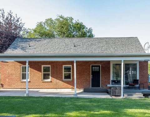 Luscious backyard with patio and grill. 