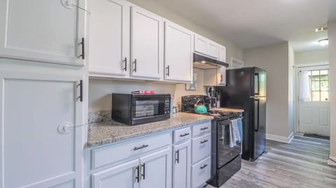 Where Culinary Wonders Unfold: A Sleek and Well-Equipped Kitchen
