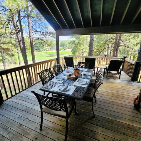 Covered outdoor dining w golf course views.
