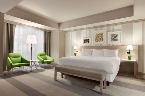 Sink into a cloud-soft king bed in a spacious retreat.