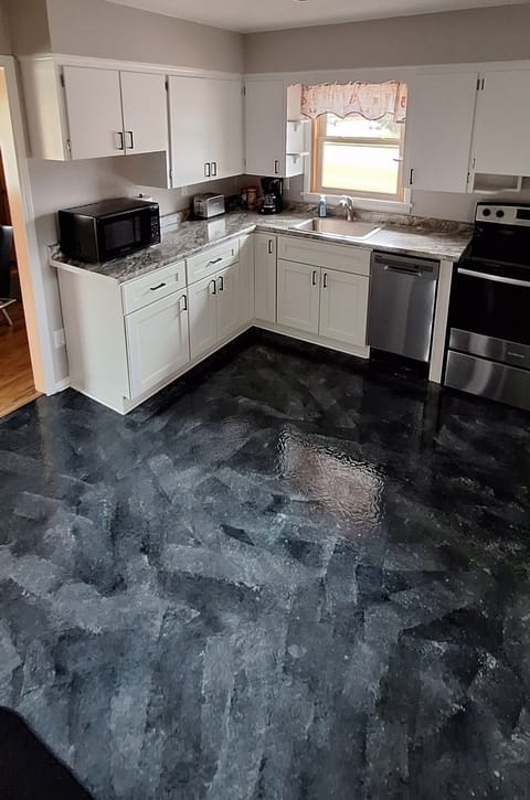 Kitchen includes microwave, toaster, coffee maker, oven and dishwasher