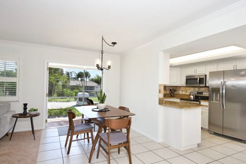 Dining area opens to screened lanai