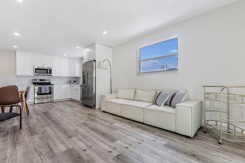 Relax comfortably in this spacious living area. *Please note that the couch has been replaced with a gray sofa bed couch as of 9/2024*