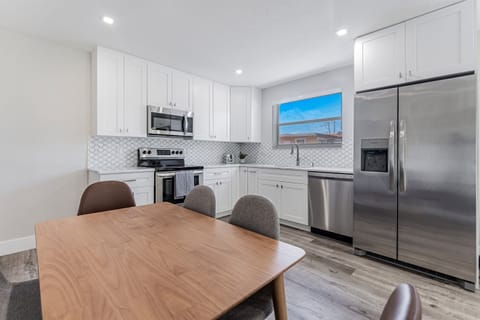 Catch up on work emails at the dining table that doubles as a work station.