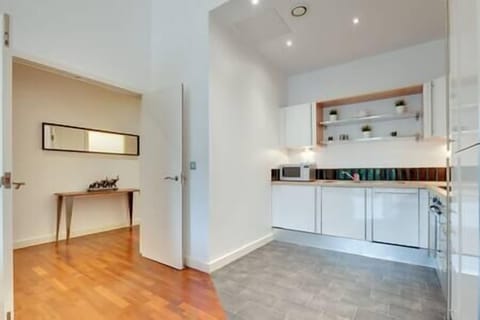 Large entrance from the hallway into the open plan kitchen/living area