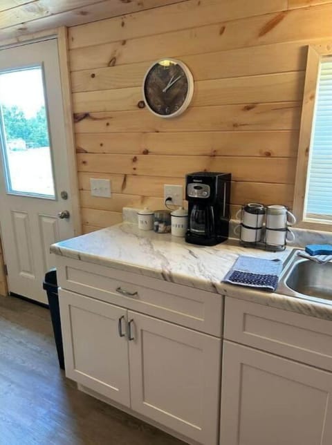 Coffee maker with complimentary coffee, sugars and creamers