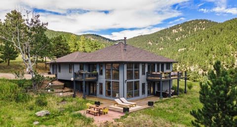 Tucked into the canyon with expansive views & floor-to-ceiling windows.
