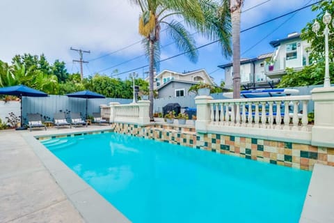A poolside oasis! Chaise loungers, outdoor dining set, umbrellas, patio heaters all create the ultimate space to relax!