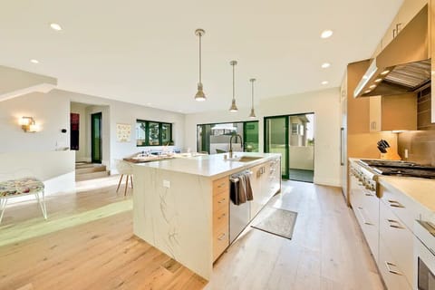 Spacious Kitchen with Table and Access to Patio